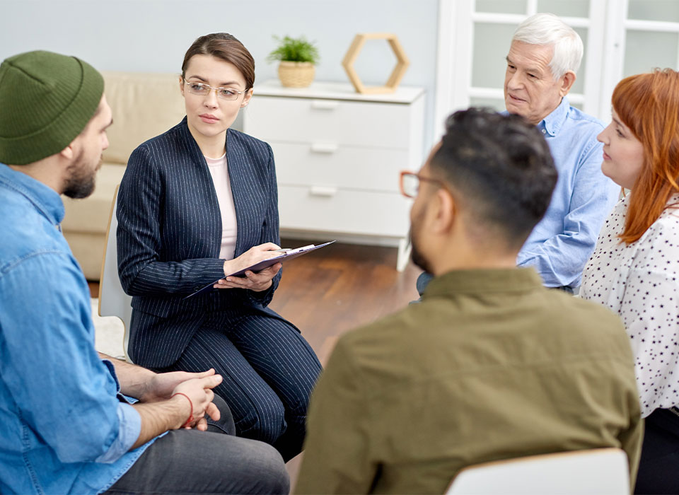 Clients in a supportive group discussion at BetterChoice, a serene addiction treatment center.